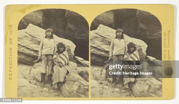 Navajo Brave and his Mother. The Navajo were formerly a warlike tribe until subdued by U.S. Troops, in 1859-60. Many of them now have fine flocks,...