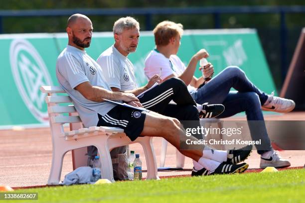 Heiko Westermann, assistant coach and Mario Himsl, assistant coach watch the KOMM MIT U17 Four Nations Tournament match between Germany U17 and Italy...