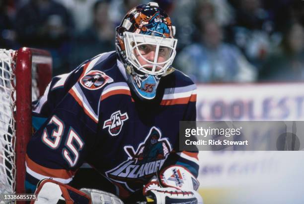 Tommy Salo from Sweden and Goaltender for the New York Islanders looks on from behind his protective helmet grille during the NHL Eastern Conference...