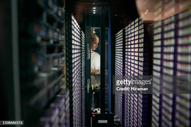 shot of a young female engineer working in a server room - data base stock pictures, royalty-free photos & images