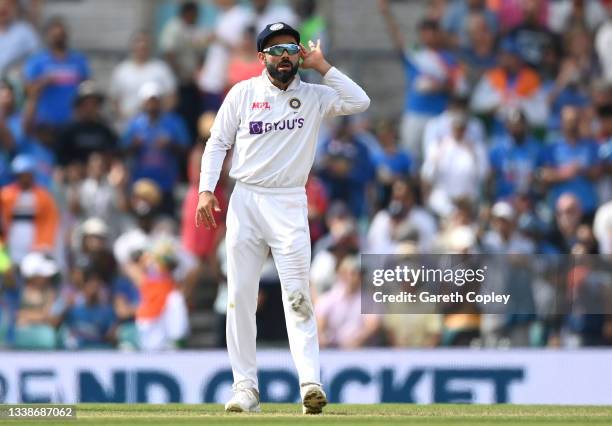 India captain Virat Kohli reacts after the wicket of Jonathan Bairstow of England during day five of the Fourth LV= Insurance Test Match between...