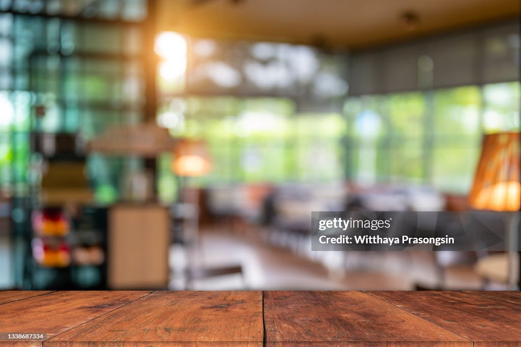 Wood table top and blurred bokeh office interior space background