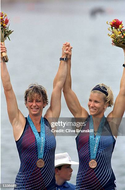 Melissa Ryan and Karen Kraft of the USA wave victoriously after winning the Bronze Medal in the Women's Pair Without Coxswain Final Event for the...