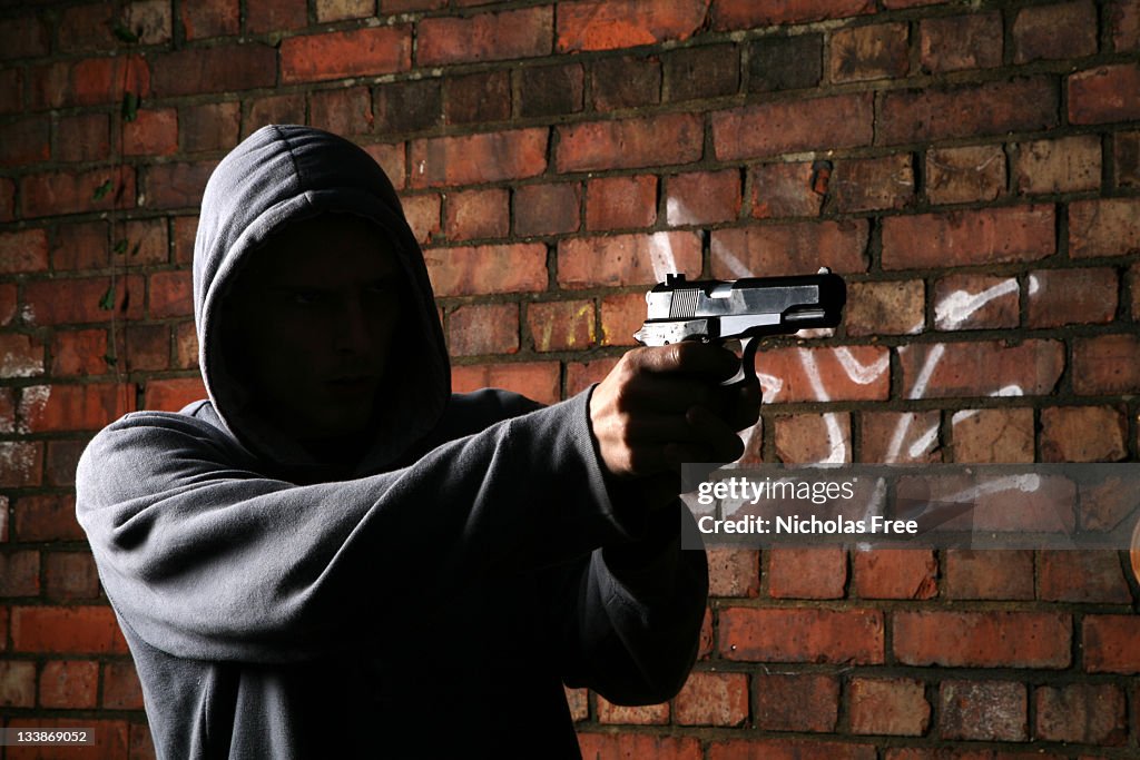 Faceless Gun Toting Hoodlum