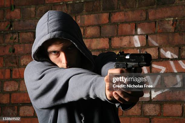 gun crime - armed robbery stock pictures, royalty-free photos & images