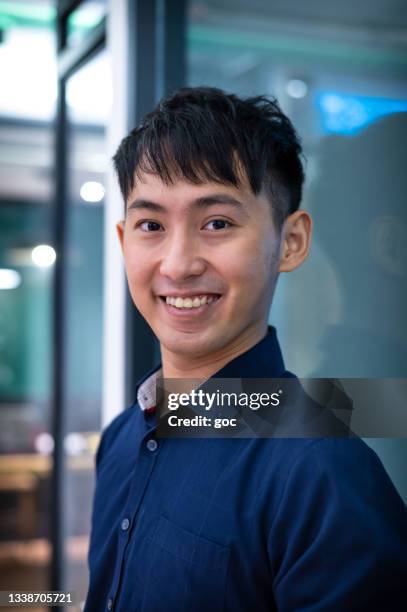 portrait of young asian business executive looking at camera - employee headshot stock pictures, royalty-free photos & images