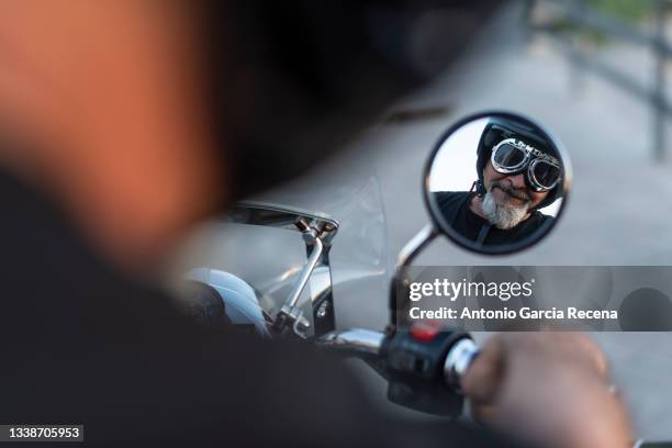 mature man with sidecar in sunset with his bike - motorcycle man stock pictures, royalty-free photos & images