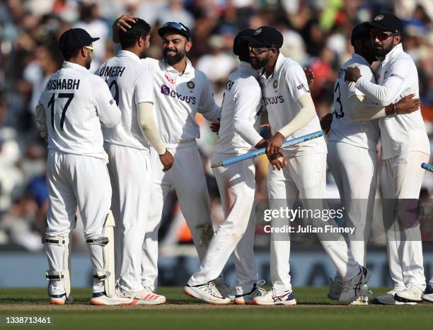 Virat Kohli of India celebrates victory with team mates during day five of the fourth LV= Insurance Test match between England and India at The Kia...