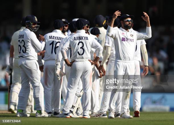 Virat Kohli of India celebrates victory with team mates during day five of the fourth LV= Insurance Test match between England and India at The Kia...