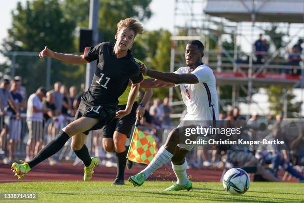 Jascha Brandt of Germany U19 is tackled by Luke Mbete of England U19 during the international friendly match between Germany U19 and England U19 at...