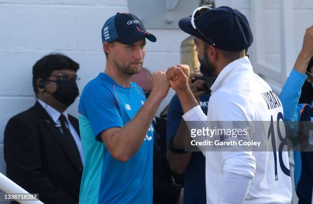 England captain Joe Root bumps fists with India captain Virat Kohli after the Fourth LV= Insurance Test Match between England and India at The Kia...