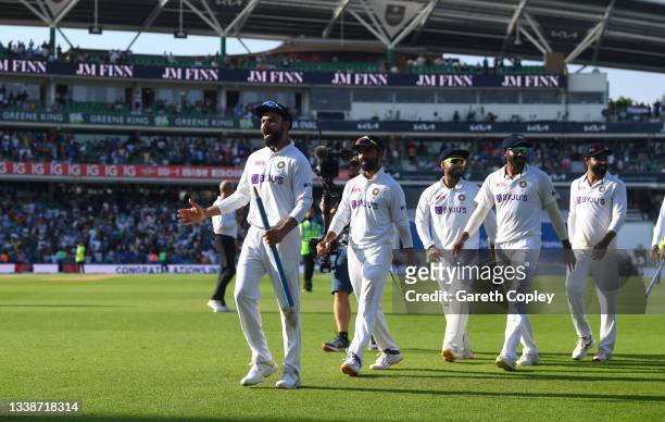 India captain Virat Kohli leads off his team after winning the Fourth LV= Insurance Test Match between England and India at The Kia Oval on September...