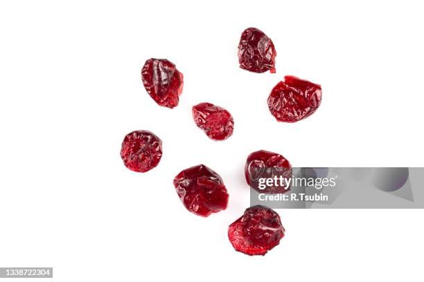pieces of dried cranberries isolated on white background - cranberry stock pictures, royalty-free photos & images