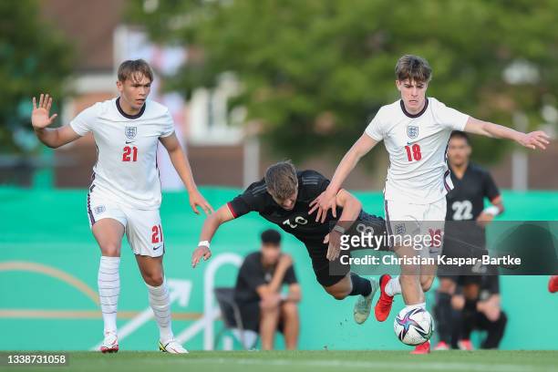 Ben Klefisch of Germany U19 is tackled by Alex Scott of England U19 and Callum Doyle of England U19 during the international friendly match between...