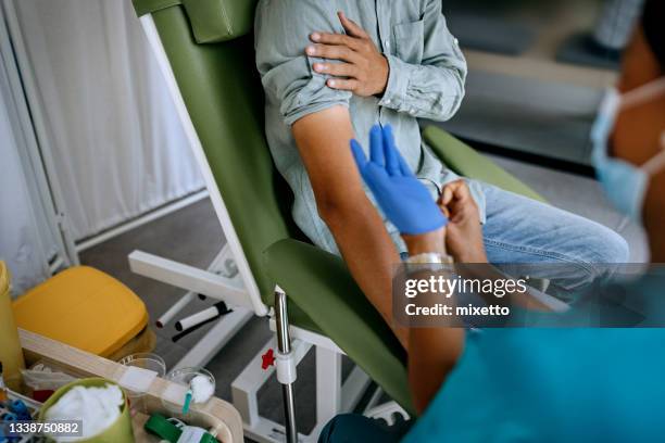 preparing patient to do a blood analysis - blood plasma stock pictures, royalty-free photos & images