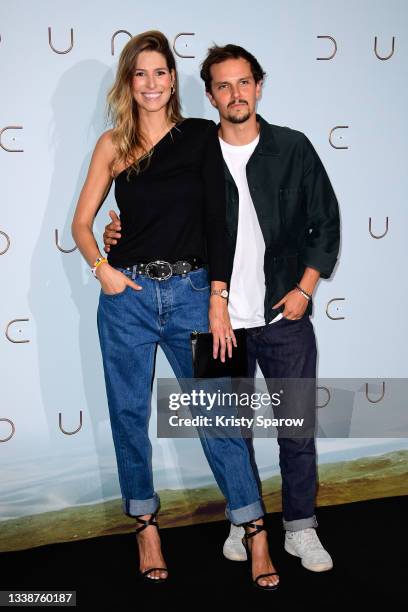 Laury Thilleman and Juan Arbelaez attend the "Dune" photocall At Le Grand Rex on September 06, 2021 in Paris, France.