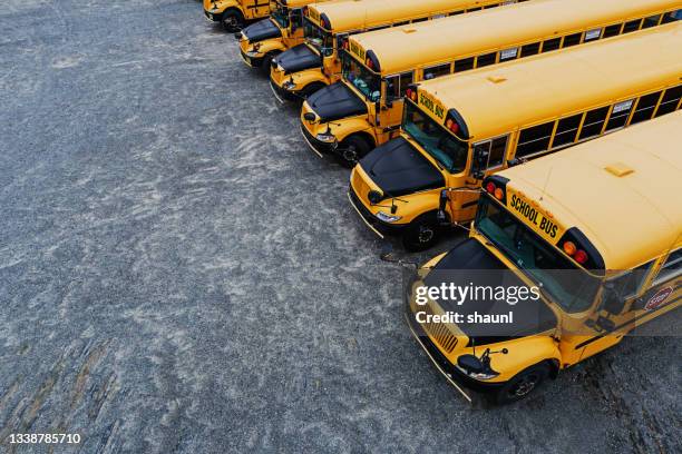 school bus lot - fleet of vehicles stock pictures, royalty-free photos & images