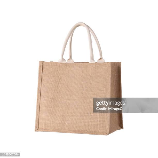 brown jute tote bag on white - boodschappentas tas stockfoto's en -beelden