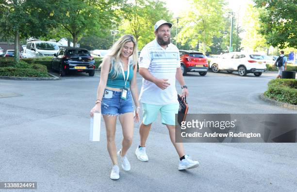 Andrew Johnston of England arrives with his partner Jodie Valencia ahead of Previews of The BMW PGA Championship at Wentworth Golf Club on September...