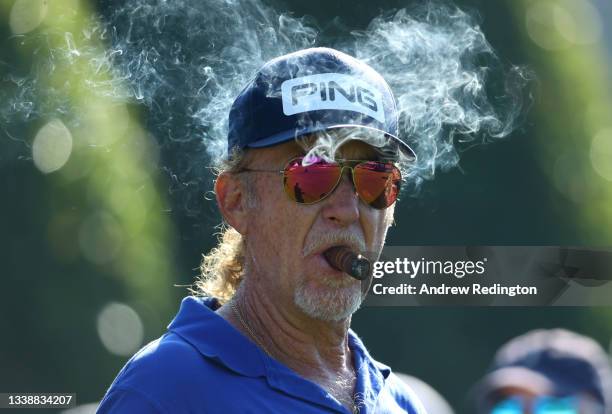 Miguel Angel Jimenez of Spain looks on as he smokes a cigar during Previews of The BMW PGA Championship at Wentworth Golf Club on September 07, 2021...