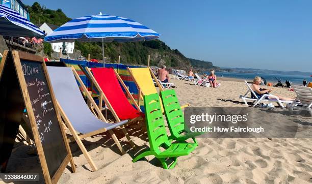 View of Deck Chairs ready to hire on Tenby North Beach as temperatures are due to rise to 25 degrees in Wales on August 07, 2021 in Tenby, Wales,...