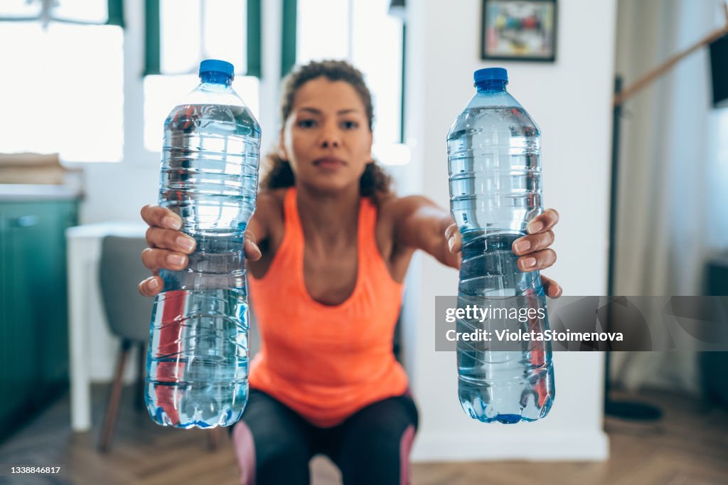https://media.gettyimages.com/id/1338846817/photo/woman-workout-at-home-with-water-bottles.jpg?s=1024x1024&w=gi&k=20&c=8LCD1lBy6-BCMYt3vgxrqMj39aAPBygb37yeK6jXgiI=