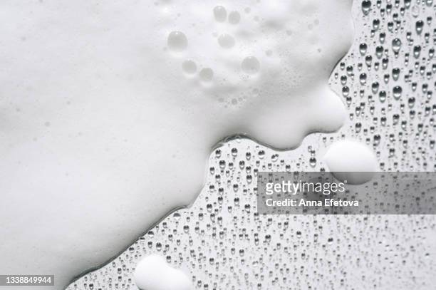 background made of white foam and many drops on white surface. backdrop for your design. flat lay style - schaumstoff stock-fotos und bilder