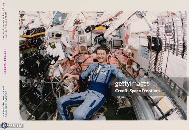 Cosmonaut Valeri Korzun, Mir-22 commander, near the camera rack on the Russian Mir Space Station's Base Block Module, 16th-26th September 1996. The...