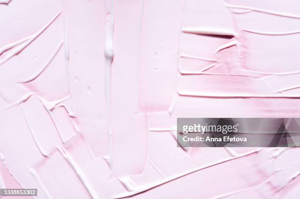 background made with textured smears of pink cream. body lotion for perfect skin. copy space for your design. macrophotography in flat lay style - femininity stock pictures, royalty-free photos & images