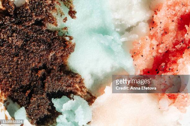 set of textured smears of brown, blue, white and red scrubs. concept of body care and beauty. macrophotography in flat lay style - clear skin red background stock pictures, royalty-free photos & images