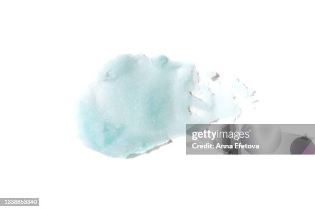 textured smear of pastel blue sugar scrub. concept of body care and beauty. macrophotography in flat lay style - body scrub stock-fotos und bilder