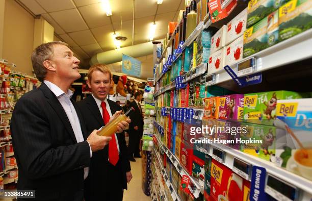 Labour leader Phil Goff and Chris Hipkins discuss food prices at Stokes Valley New World supermarket on November 22, 2011 in Wellington, New Zealand....