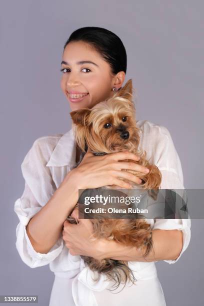 young woman with a little dog. - yorkshire terrier vet stock pictures, royalty-free photos & images