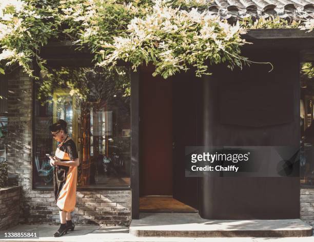 facade of a small shop - beijing people stock pictures, royalty-free photos & images