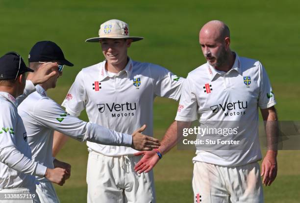 Durham bowler Chris Rushworth is congratulated after taking the wicket of Glamorgan batsman Hamish Rutherford for his 50th Championship wicket of the...