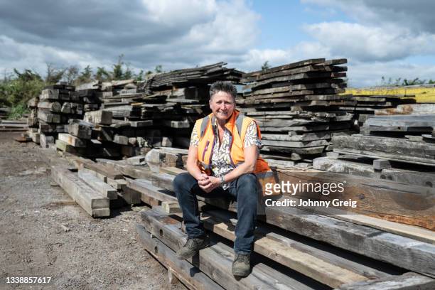 lumberyard portrait of reclamation industry businesswoman - femalefocuscollection stock pictures, royalty-free photos & images