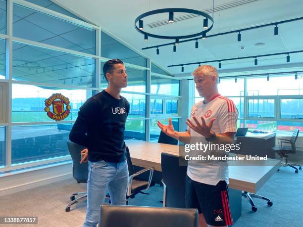 Manager Ole Gunnar Solskjaer of Manchester United meets Cristiano Ronaldo at Carrington Training Ground on September 07, 2021 in Manchester, England.