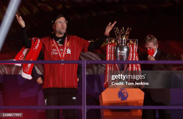 Jurgen Klopp puts on his winners medal at the Premier League trophy presentation on The Kop following the Liverpool v Chelsea Premier League match at...