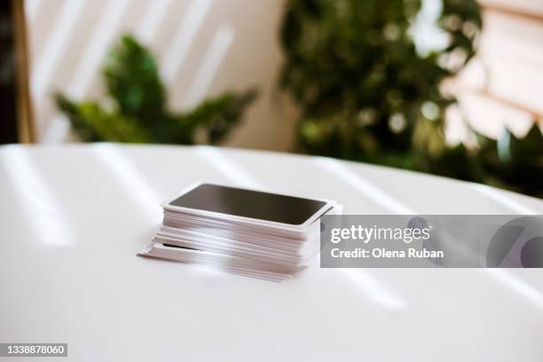 playing cards on white table. - tarot cards stockfoto's en -beelden