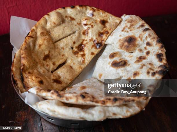 close up of homemade roti (or chapati) served on table. - naan stock pictures, royalty-free photos & images