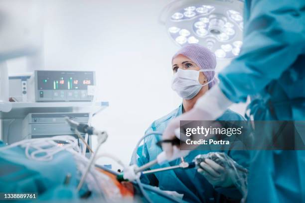 medical team performing gastric bypass surgery - surgery bildbanksfoton och bilder