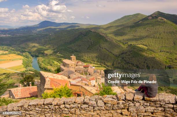 woman admiring gallipienzo antiguo village, navarre, spain. - comunidad foral de navarra fotografías e imágenes de stock