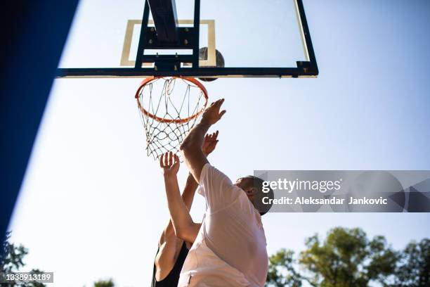 taking it to the rack - pick up basketball stock pictures, royalty-free photos & images