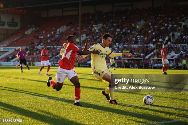 Joel Lopez of Arsenal shields the ball from Mohammad Dabre of Swindon Town during the Papa John's Trophy match between Swindon Town and Arsenal U21...