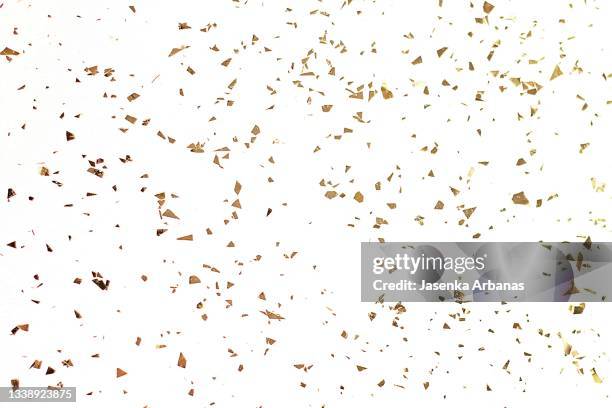 golden confetti  on the white  background - gold glitter stockfoto's en -beelden