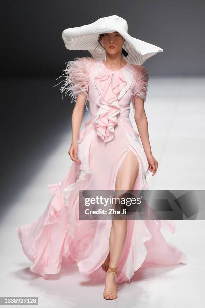 Model showcases designs on runway at the YOUG X Collection show by designer Xing Yong during the China Fashion Week Spring/Summer 2022 at 751D.PARK...