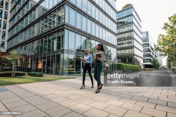 african american business people in financial district, models full length shown - eco house stock pictures, royalty-free photos & images