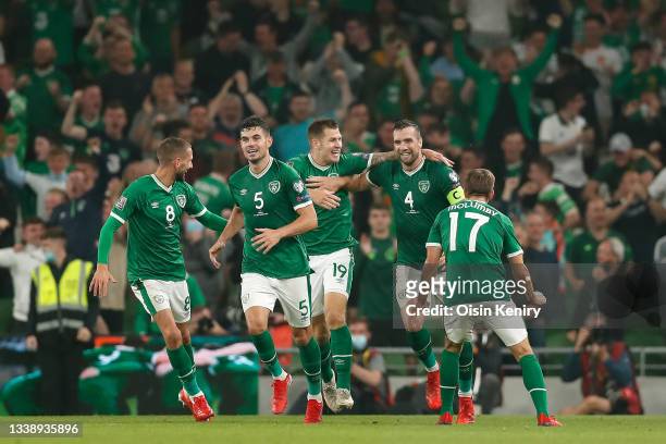 Conor Hourihane, John Egan, James Collins and Shane Duffy of Republic of Ireland celebrate their side's first goal, an own goal by Nikola Milenkovic...