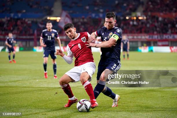 Yusuf Demir of Austria battles for possession with Andy Robertson of Scotland during the 2022 FIFA World Cup Qualifier match between Austria and...