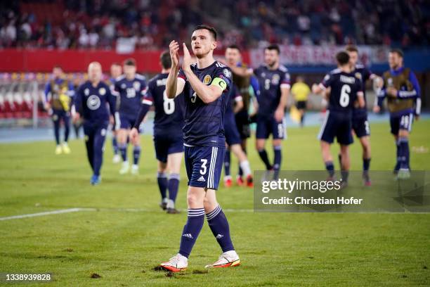 Andy Robertson of Scotland applauds the fans following their side's victory after the 2022 FIFA World Cup Qualifier match between Austria and...